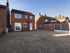 Rear elevation/parking area- click for photo gallery